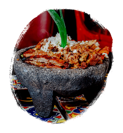 A molcajete piled high with meat, a traditional Mexican food dish at Guadalajara