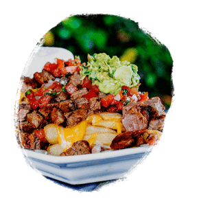 Our Carne Asada fries topped with guacamole and sour cream