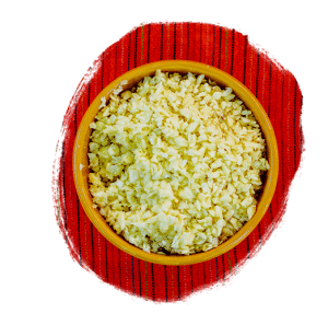 Minced garlic in a bowl on a red tablecloth
