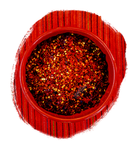 Dried red chilies in a bowl on a red tablecloth